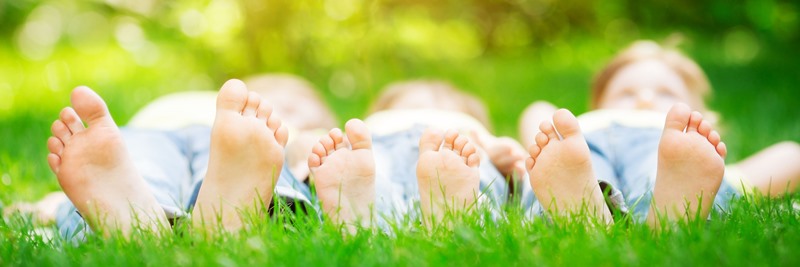 Family lying on grass
